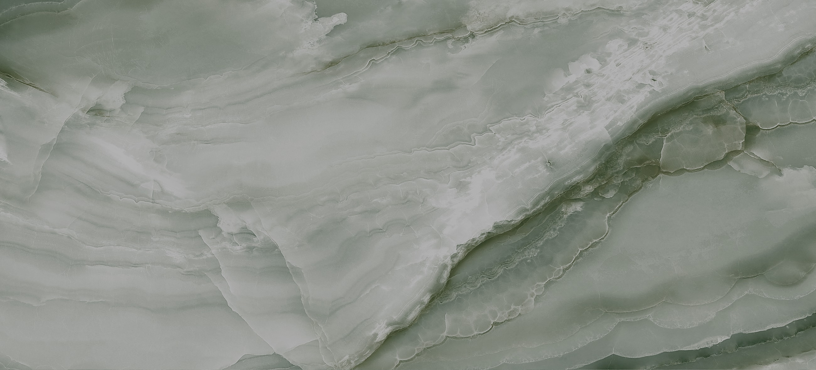 Textured light green marble surface background.