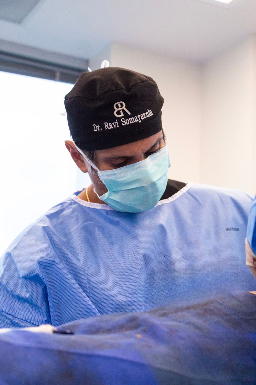 Surgeon focused during a medical procedure.