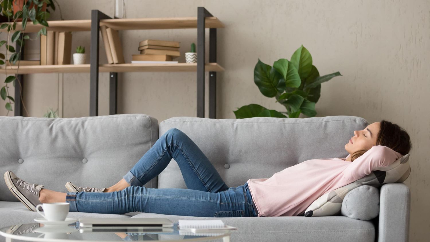 Woman relaxing on a couch at home.