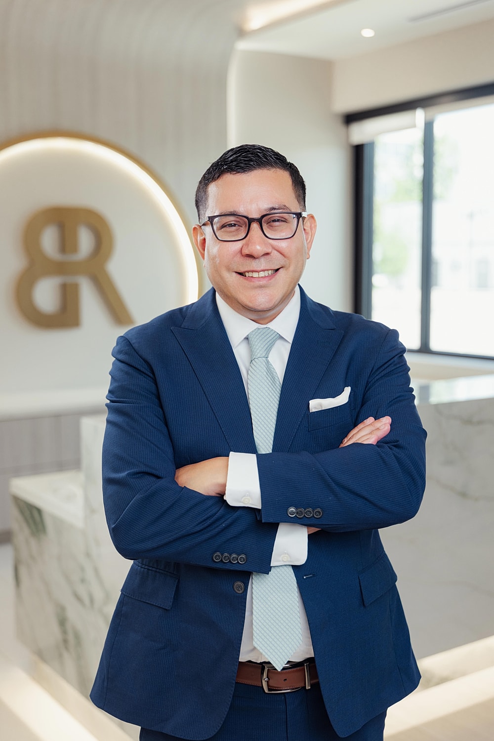 Business professional smiling in an office setting.