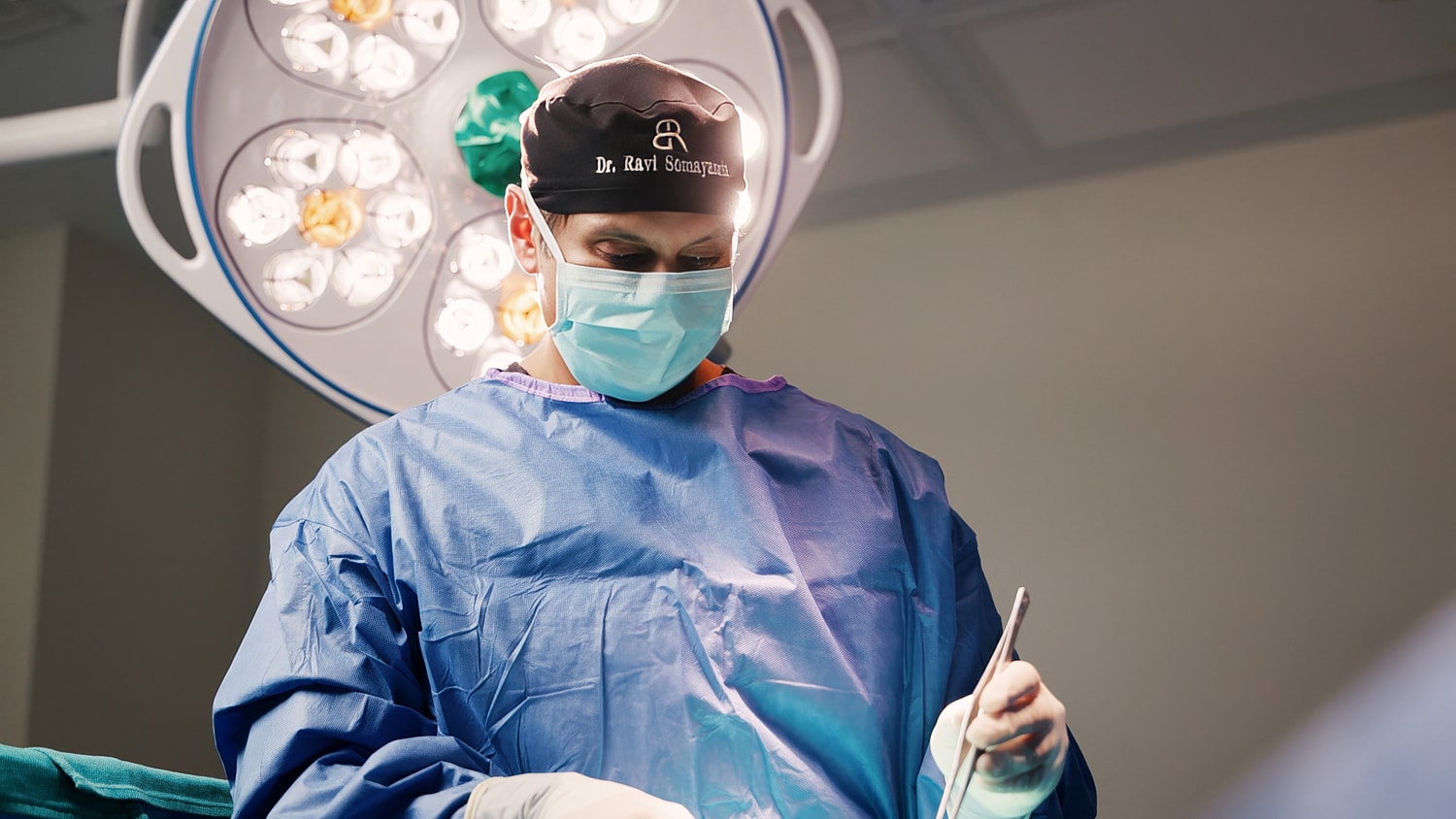 Dr. Ravi preparing for a medical procedure.