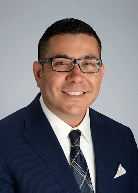 Professional man in a suit and glasses.
