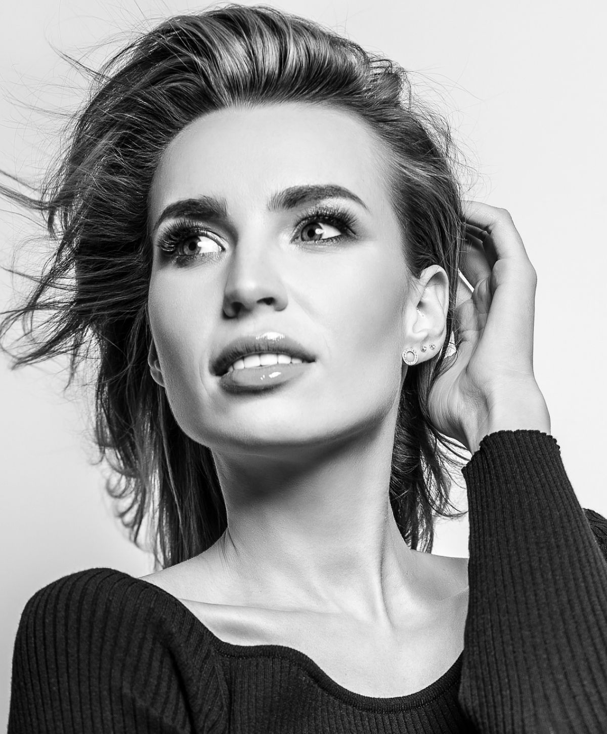 Black and white portrait of a thoughtful woman.