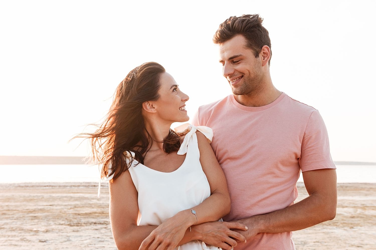 Couple enjoying a moment together on the beach.